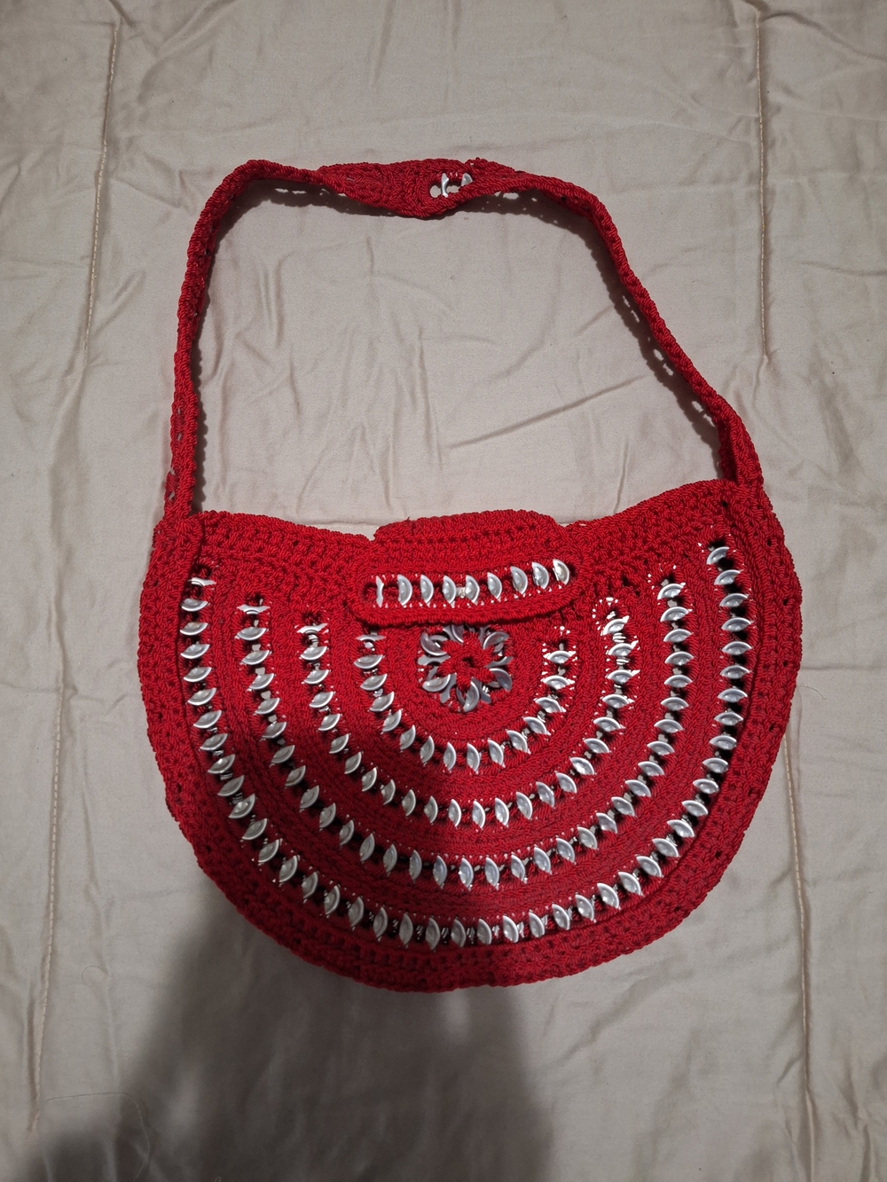 Handmade red crochet shoulder bag.